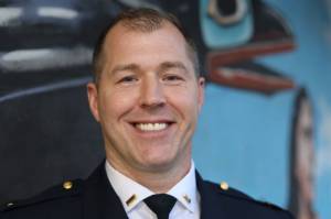 Lt. Krag Campbell with the Juneau Police Department smiles for a photo Tuesday evening outside of City Hall. Campbell is one of two finalists seeking the chief position at the department. (Clarise Larson / Juneau Empire)