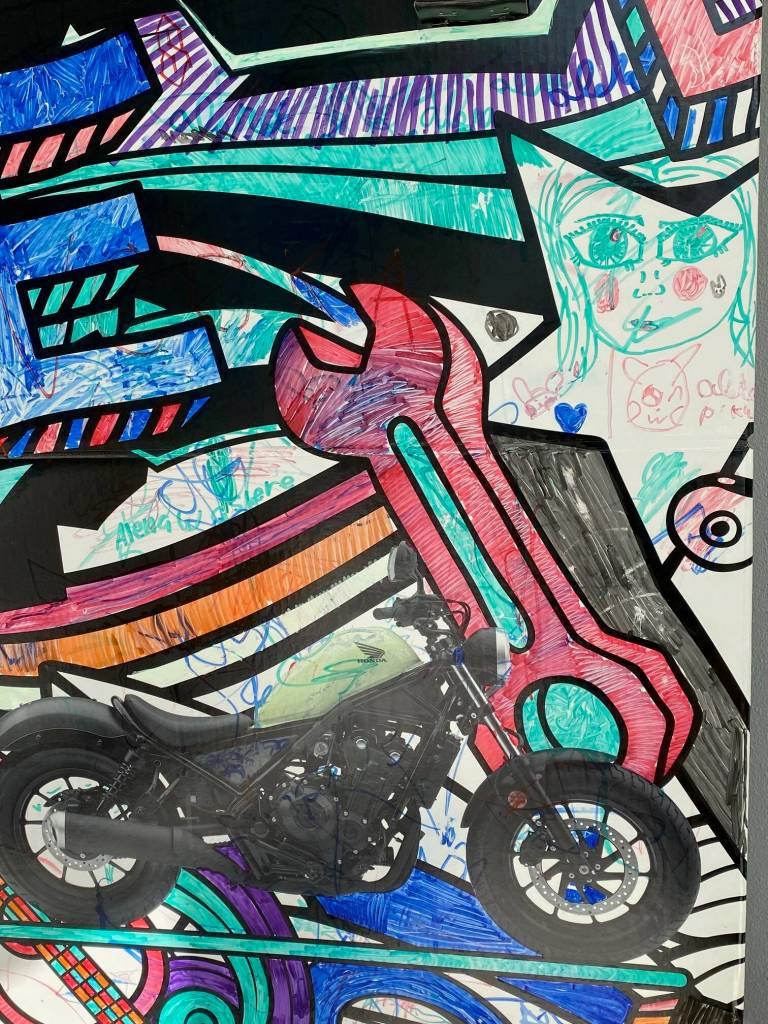 A little bit of everything on a downtown corner wall on Sept. 5. (Photo by Denise Carroll)