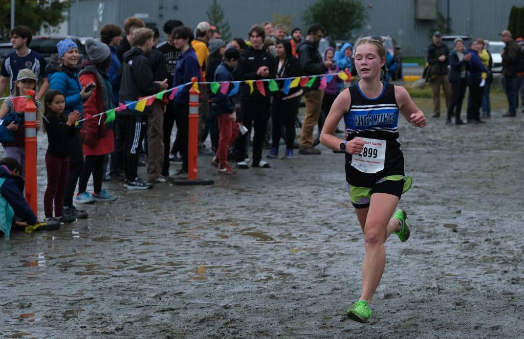 Thunder Mountain sophomore Della Mearig sprints to the finish of the Division I Region V Girls Cross Country Championship race on Saturday at Treadwell Mine Trails. (Klas Stolpe / For the Juneau Empire)