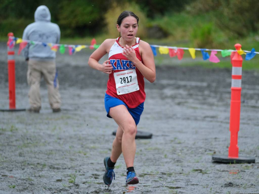 Kake High School senior Jillian Jackson sprints to the finish of the Division III Region V Girls Cross Country Championship race on Saturday, at Treadwell Mine Trails. (Klas Stolpe / For the Juneau Empire