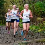 Juneau-Douglas High School: Yadaa.at Kalé senior Etta Eller (2868) leads JDHS junior Ida Meyer (2870), Sitka junior Clare Mullin (2929) and JDHS senior Rayna Tuckwood (2873) during the Region V Division I Girls Cross Country Championship on Saturday at Treadwell Mine Trails. (Klas Stolpe / For the Juneau Empire)
