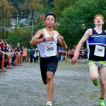 Juneau-Douglas High School: Yadaa.at Kalé senior Edgar Vera Alverado, left, holds off Thunder Mountain freshman Erik Thompson to win the Region V Division I Boys Cross Country Championship on Saturday at Treadwell Mine Trails. (Klas Stolpe / For the Juneau Empire)