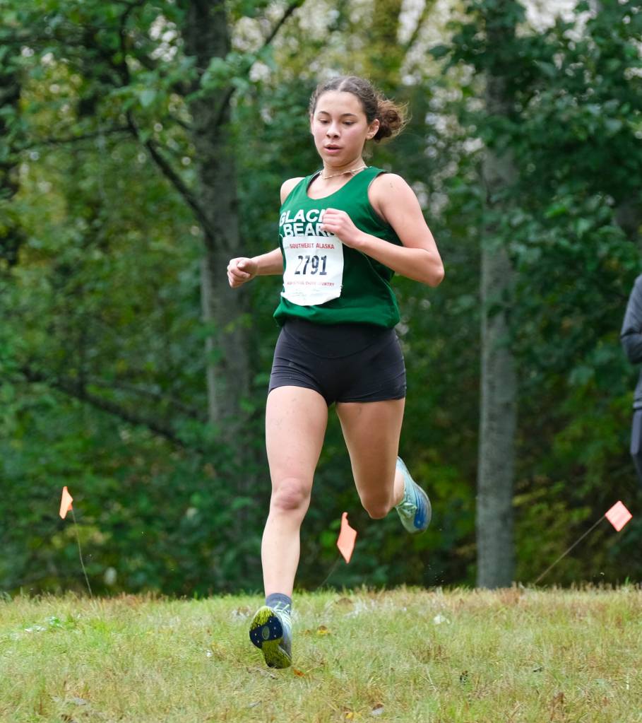 Haines junior Ariel Godinez Long runs alone to a win in the Division III Region V Girls Cross Country Championship race on Saturday at Treadwell Mine Trails. (Klas Stolpe / For the Juneau Empire)