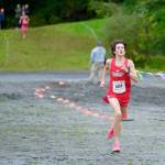 Wrangell sophomore Boomchain Loucks sprints to win the Division III Region V Boys Cross Country Championship race on Saturday at Treadwell Mine Trails. (Klas Stolpe / For the Juneau Empire)