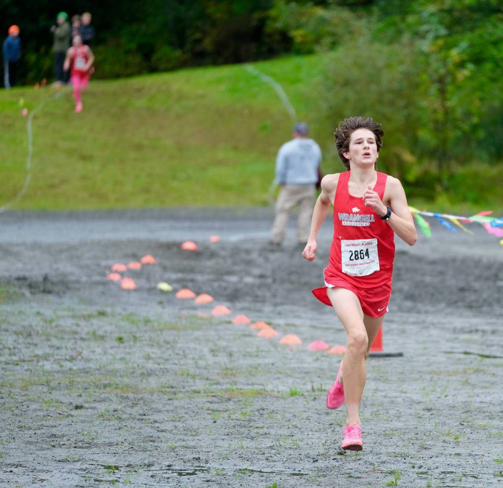 Wrangell sophomore Boomchain Loucks sprints to win the Division III Region V Boys Cross Country Championship race on Saturday at Treadwell Mine Trails. (Klas Stolpe / For the Juneau Empire)