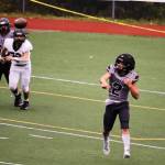 Hayden Aube throws as he tries to rally Juneau during the Huskies game against Anchorage South High School on Saturday at Adair-Kennedy Field. Aube, a junior, began the season at running back, but has increasingly seen time at quarterback throughout the season. (Mark Sabbatini / Juneau Empire)