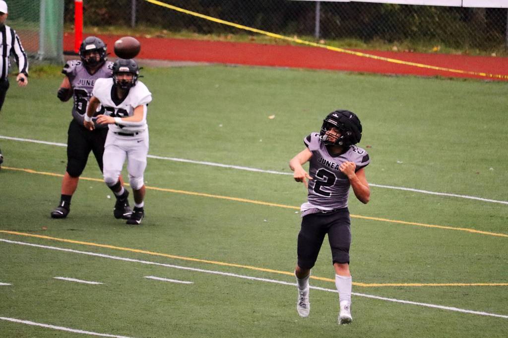 Hayden Aube throws as he tries to rally Juneau during the Huskies game against Anchorage South High School on Saturday at Adair-Kennedy Field. Aube, a junior, began the season at running back, but has increasingly seen time at quarterback throughout the season. (Mark Sabbatini / Juneau Empire)