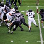 An Anchorage South High School ballcarrier is gang tackled by Juneaus defense during Saturdays game at Adair-Kennedy Field. (Mark Sabbatini / Juneau Empire)