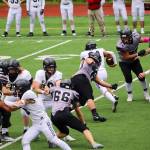 An Anchorage South High School runner takes advantage of gaping hole against the Juneau Huskies during Saturdays game at Adair-Kennedy Field. (Mark Sabbatini / Juneau Empire)