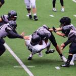 Juneau Huskies senior Eric Tipton (88) levels Anchorage South High School wide receiver Landon Drumm during Saturdays game at Adair-Kennedy Field. (Mark Sabbatini / Juneau Empire)