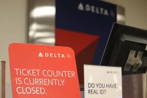 A closed sign sits on Deltas ticket counter after hours inside Juneau International Airport in August of 2022. The airline announced this week it is suspending service between Juneau and Seattle from Nov. 4 to June 6, 2024. (Jonson Kuhn / Juneau Empire File)