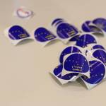 Stickers lay scattered on a table at the voter center located at the Mendenhall Valley Public Library on Tuesday afternoon. (Clarise Larson / Juneau Empire)