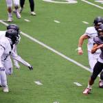 Jayden Johnson (4), a junior for the Juneau Huskies, looks for room to run against Anchorage South during their game Sept. 30 at Adair-Kennedy Field. The Alaska Sports Report calls Johnson most explosive player in the state as the state playoffs begin Friday night. (Mark Sabbatini / Juneau Empire File)