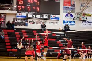 Nikki King (16), a senior, attempts to block a shot for Juneau-Douglas High School: Yadaa.at Kalé during the teams game against Mt. Edgecumbe High School on Thursday night at JDHS. (Mark Sabbatini / Juneau Empire)