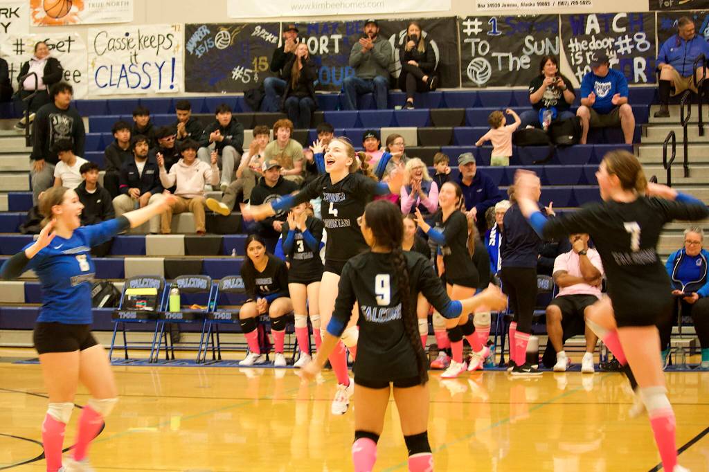 Thunder Mountain High School players celebrate their winning point in the fourth set to claim Saturdays game against Mt. Edgecumbe High School at TMHS. (Mark Sabbatini / Juneau Empire)