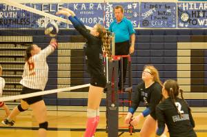 Thunder Mountain High Schools Jenna Dobson (4) knocks the ball past a Mt. Edgecumbe High School player on Saturday night at TMHS. (Mark Sabbatini / Juneau Empire)