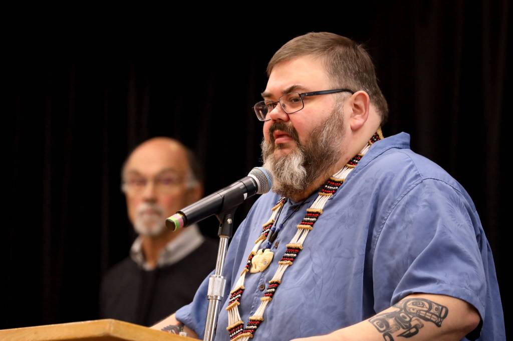 Richard Chalyee Éesh Peterson, president of the Central Council of the Tlingit and Haida Indian Tribes of Alaska, speaks to the crowd on stage during a healing event on Indigenous Peoples Day on Monday to acknowledge and accept an apology of the closure of Juneaus Memorial Presbyterian Church in 1962. (Clarise Larson / Juneau Empire)