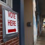A man heads to the City Hall Assembly Chambers to cast his ballot on Election Day on Oct. 3. (Clarise Larson / Juneau Empire File)