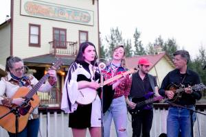 Muskeg Collective members Erin Heist, Annie Bartholomew, Taylor Vidic and Josh Fortenbery, plus special guest Andrew Heist, perform at The Golden Saloon in McCarthy in early August. The group will be featured at the Cowboy Ball on Saturday at the Juneau Arts and Culture Center. (Photo by Cam Jimmo)