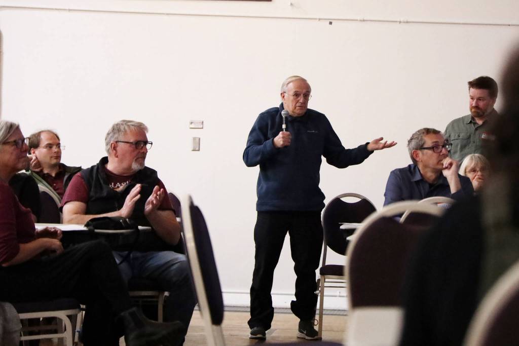 Juneau resident Charles VanKirk is greeted with an applause as he speaks to attendees at an open house on Telephone Hill developments on Wednesday evening at the Juneau Arts and Culture Center. (Clarise Larson / Juneau Empire)