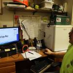 Chris Anderson touches up the design for the new Heritage Way signs in the making ahead of the South Seward Street name change Nov. 1. (Clarise Larson / Juneau Empire)