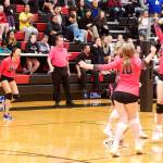 Chugiak High School players celebrate their victory in the championship game of the Juneau Invitational Volleyball Extravaganza at Juneau-Douglas High School: Yadaa.at Kalé on Saturday. (Mark Sabbatini / Juneau Empire)