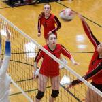 Juneau-Douglas High School: Yadaa.at Kalés Kiah Yadao (5) knocks the ball past Thunder Mountain High Schools Jenna Dobson during their semifinal game in the Juneau Invitational Volleyball Extravaganza at JDHS on Saturday. (Mark Sabbatini / Juneau Empire)
