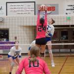 Thunder Mountain High Schools Jenna Dobson (4) tries to get the ball past Chugiak High Schools Keira Burrell during the championship game of the Juneau Invitational Volleyball Extravaganza at Juneau-Douglas High School: Yadaa.at Kalé on Saturday. (Mark Sabbatini / Juneau Empire)