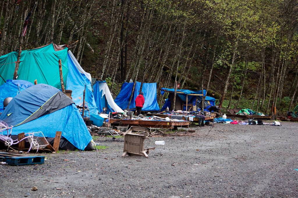 An assortment of furniture, clothing and other household items are exposed to the elements at Mill Campground on Sunday after being left behind by residents who departed ahead of Mondays closing. (Mark Sabbatini / Juneau Empire)