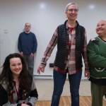 Rhoda Walker, right, Sharon Early, and Audrey Kohler work on their improvisation as Mike Christenson, left, and Seth Caron prepare to enter during a rehearsal at Christensons house on Thursday, Dec. 21, 2017. Kohler, now a Seattle resident, is returning as part of a nine-person group to perform an improv comedy show at Crystal Saloon on Friday. (Michael Penn / Juneau Empire File)