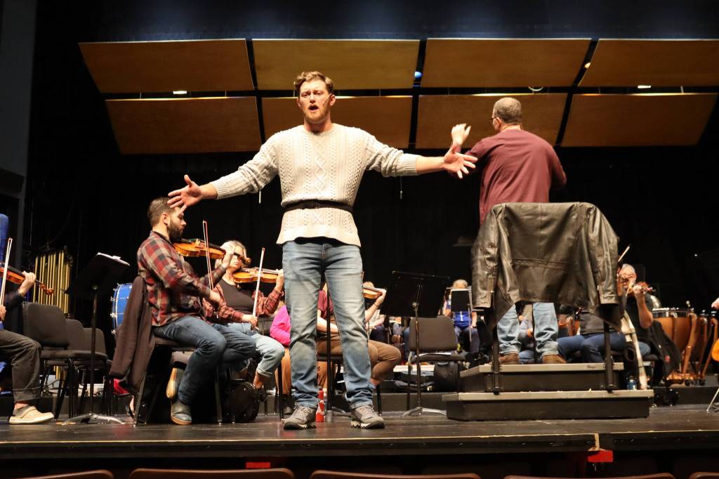 Tanner Johnson, playing the role of Candide, rehearses Tuesday at Juneau-Douglas High School: Yadaa.at Kalé. The operetta Candide is based on Stephen Sondheims adaptation of the classic novella by Voltaire. (Meredith Jordan/ Juneau Empire)