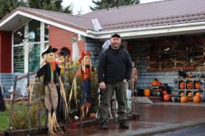 Dan Earl stands in front of his home, which is temporarily transformed into Earls Haunted Garage around the time of Halloween in Juneau for nearly the last 20 years, in early October of 2022. (Jonson Kuhn / Juneau Empire File)