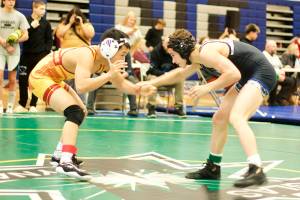 Jed Davis of Thunder Mountain High School, right, and Evan Andrew of Mt. Edgecumbe High School face off in the 125-pound division during the Southeast Showdown at TMHS on Saturday. (Mark Sabbatini / Juneau Empire)