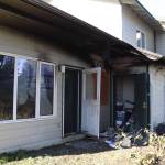 The back side of a unit in an apartment complex at 2800 Postal Way that caught fire on Sunday evening. No one was injured in the blaze, which left its occupant temporarily homeless and a neighbors home with smoke damage. (Meredith Jordan/ Juneau Empire.)