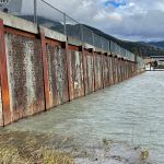 A Mendenhall River area retaining wall built with segments of the roadbed from the first Douglas Bridge. Texture of the traffic-worn decking can be seen on the upright panels. (Photo by Laurie Craig)