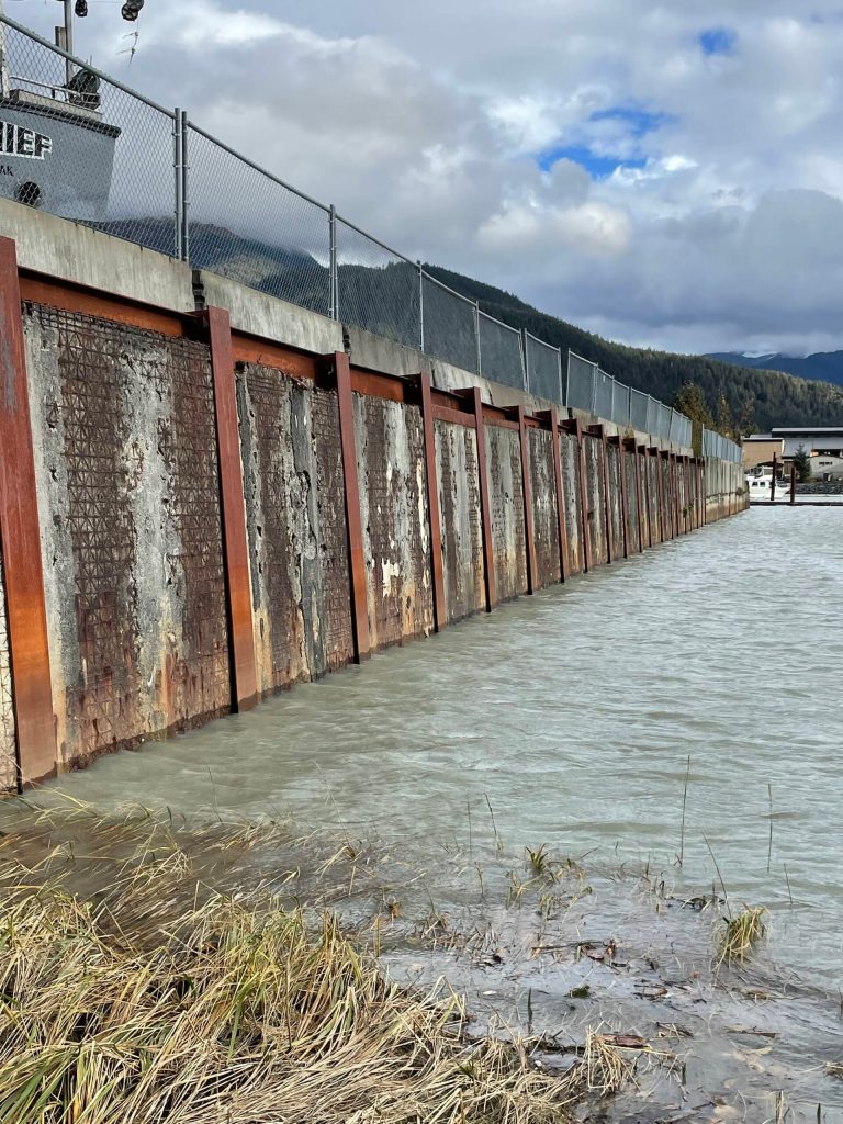 A Mendenhall River area retaining wall built with segments of the roadbed from the first Douglas Bridge. Texture of the traffic-worn decking can be seen on the upright panels. (Photo by Laurie Craig)