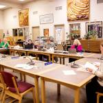 Emily Wright, an assistant attorney for the City and Borough of Juneau, explains legal ramifications of the states new ban on transgender girls participating in girls high school sports to the Juneau Board of Education on Tuesday night at Juneau-Douglas High School: Yadaa.at Kalé. (Mark Sabbatini / Juneau Empire)