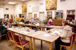 Emily Wright, an assistant attorney for the City and Borough of Juneau, explains legal ramifications of the states new ban on transgender girls participating in girls high school sports to the Juneau Board of Education on Tuesday night at Juneau-Douglas High School: Yadaa.at Kalé. (Mark Sabbatini / Juneau Empire)