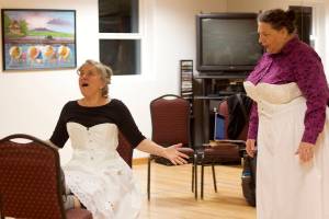 Marta Lastufka (left) plays the lead role of Nora while Becky Orford plays Anne Marie in a rehearsal of A Dolls House, Part 2 at the Filipino Community Hall on Thursday. The play is scheduled to debut at the hall at 7 p.m. next Wednesday, with 12 more performances at venues around Juneau through Nov. 19. (Mark Sabbatini / Juneau Empire)