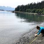 University of Alaska Southeast graduate student Muriel Walatka gathers samples of beach sand to examine for microplastics at Auke Recreation Area in August 2019. (Photo courtesy Sonia Nagorski)