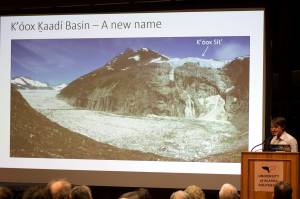 University of Alaska environmental science professor Eran Hood (foreground right) and National Weather Service Juneau hydrologist Aaron Jacobs discuss their hope of renaming Suicide Basin to Kʼóox Ḵaadí Basin, a Tlingit name referring to a small weasel-like mammal in the area  during a presentation Friday at the University of Alaska Southeast. They also discussed the basins history, a record flood from it that occurred this summer and the possibility of future such floods. (Mark Sabbatini / Juneau Empire)