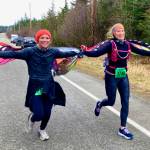 Suzanne Morris, left, and Melissa Anderson finish the Halloween Half Marathon on Saturday. (Klas Stolpe for the Juneau Empire)