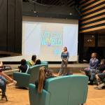 Genevieve Grenier, the outgoing Miss Alaska Volunteer, addresses Troy Michael Smith and others at his sendoff party for the Mr. Gay World competition, an event coordinated with the Alaska chapter of American Foundation, where he serves on the board. Pictured are Laurie and Rick Nusbaum, seated next to Smith, Josephine Herbert (Miss Alaska Teen Volunteer 2024) and Savannah Mason (Miss Matsu Teen Volunteer). Smith  who won the competition Oct. 27  is scheduled to return to Anchorage on Tuesday. (Photo courtesy of Alyse Galvin)