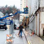 Workers remove awning from the old Elks Lodge building at 109 S. Franklin St. at midday Monday. While heavy construction equipment is parked next to the structure, the owner says no decision about the fate of the building has been made yet. (Mark Sabbatini / Juneau Empire)