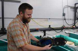 Henry Fleener, hatchery manager at Ted Stevens Marine Research Institute Mariculture Wet Lab, talks about a NOAA Fisheries project that involves building a small hatchery to house, condition and spawn oyster broodstock in order to find ways to improve existing processes. (Meredith Jordan/ Juneau Empire)