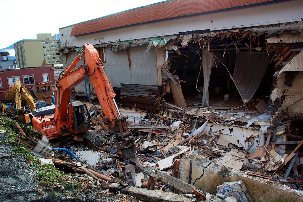 Remains of a portion of the historic Elks Lodge at 109 S. Franklin St. lie amidst heavy equipment on Wednesday afternoon. Most of the teardown work appears to involve an addition at the rear to the original 1908 building. (Mark Sabbatini / Juneau Empire)