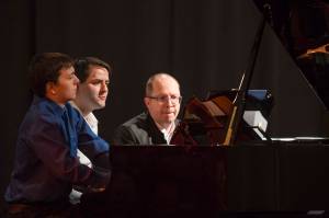 Michael Penn / Juneau Empire File
Kyle Farley-Robinson, left, Jon Hays, center, and Dr. Alexander Tutunov play Romance And Waltz For Six Hands Piano by Sergei Rachmaninoff during the Juneau Piano Series featuring Dr. Tutunov at the Juneau Arts and Culture Center on Friday, Jan. 18, 2019.