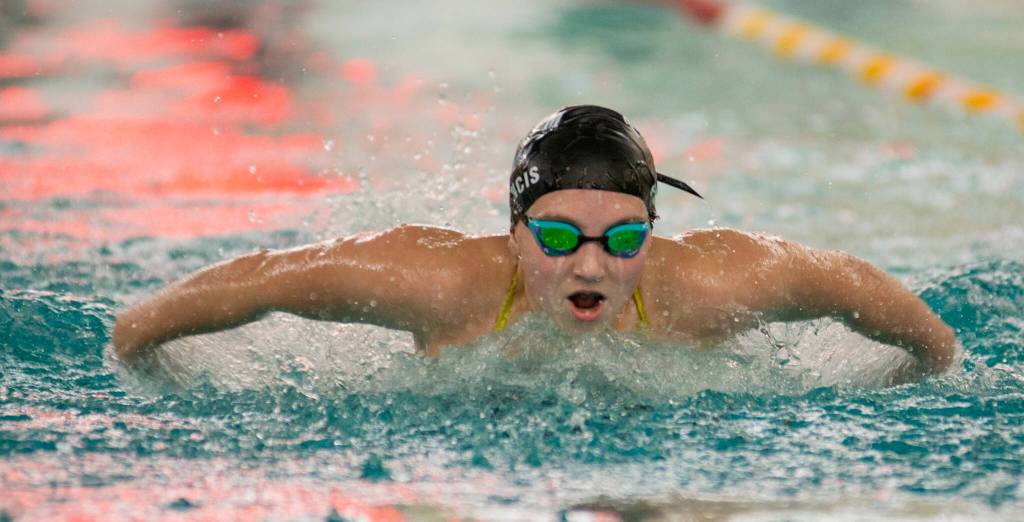 Juneau-Douglas High School: Yadaa.at Kalé junior Emma Fellman swims to a 200 IM Region V Championship last weekend at Sitka. Fellman will defend her state title this weekend in the ASAA State Championships at the Dimond Park Aquatic Center. (James Poulson/Daily Sitka Sentinel)