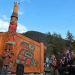 Hundreds of people gathered in raincoats and boots at the Twin Lakes Kaasei Totem Plaza for a ceremony unveiling a Tlingit healing totem pole and screens on Oct. 1, 2022. (Clarise Larson / Juneau Empire File)