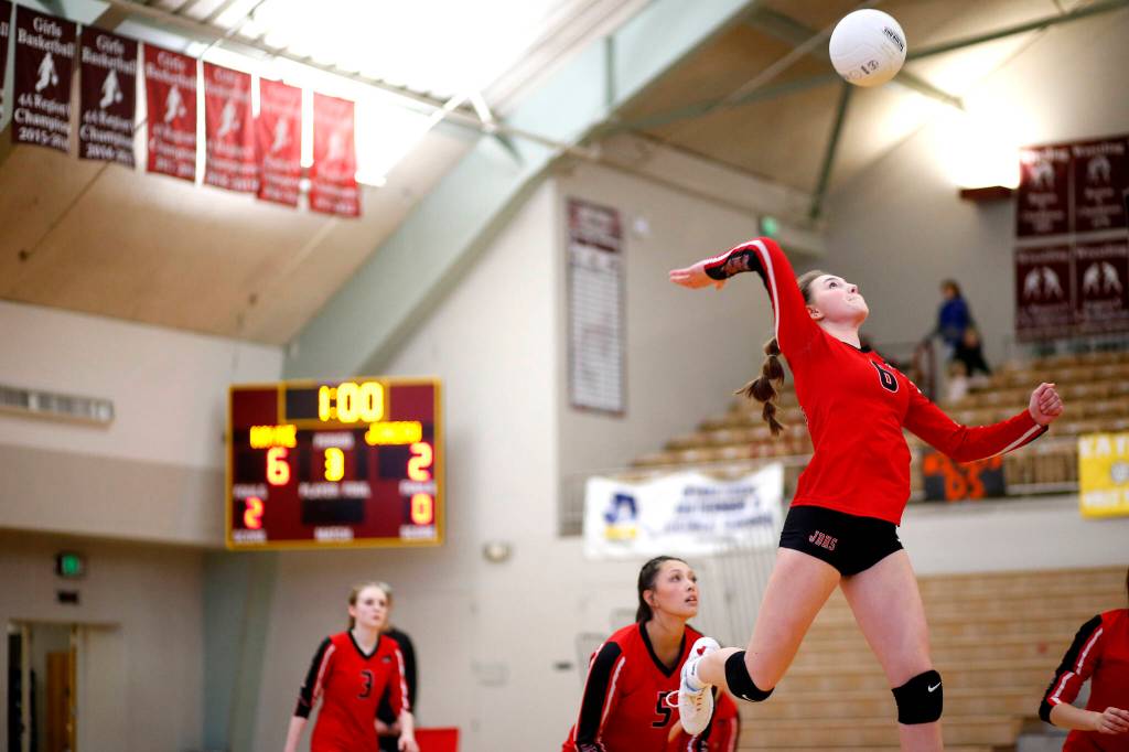 Juneau-Douglas High School: Yadaa.at Kalés Gwen Nizich hits the ball during their 3-0 loss to Ketchikan High School during the Region V Volleyball Tournament at Ketchikan on Saturday. (Christopher Mullen / Ketchikan Daily News)